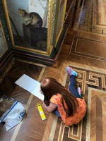 Daughter of our tourist is busy painting in the Raphael Loggias, children tour of the Hermitage museum