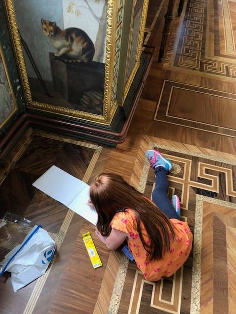 St Petersburg Russia tours: Daughter of our tourist is busy painting in the Raphael...